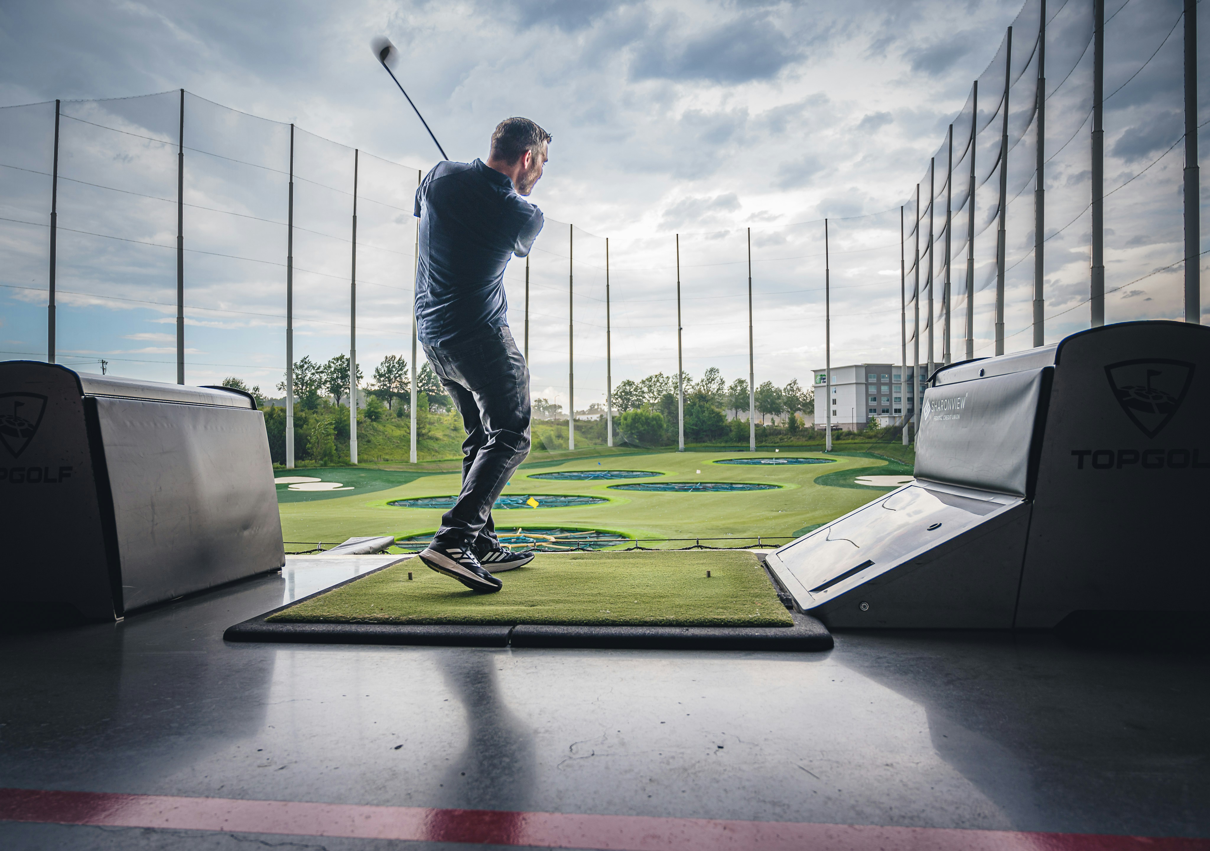 Beginner golfer at the driving range