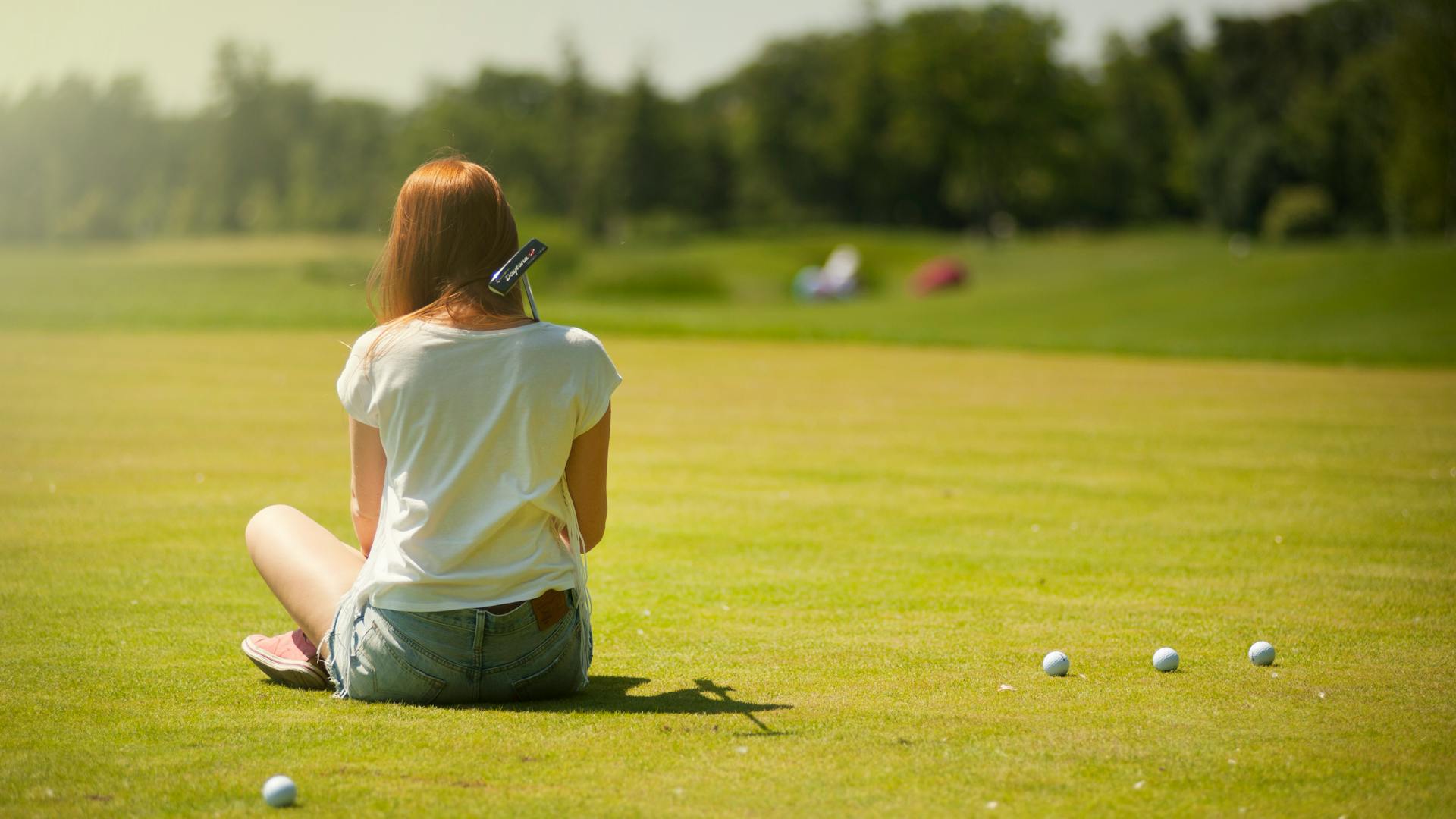 Golfer pausing on the course to collect thoughts before a shot