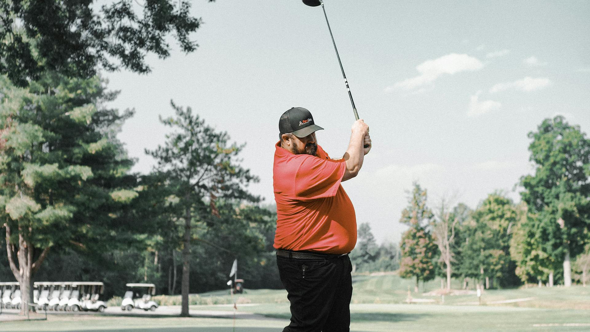 Golfer at the tee demonstrating the correct driver setup and address position